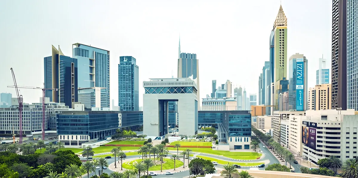 A panoramic view of a residential building in International City Dubai on a bright, sunny day with a clear blue sky.