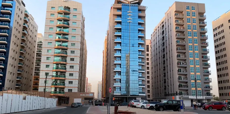 A view of Al Nahda 2 Residence, featuring contemporary residential buildings and well-maintained apartments in a tranquil neighborhood.